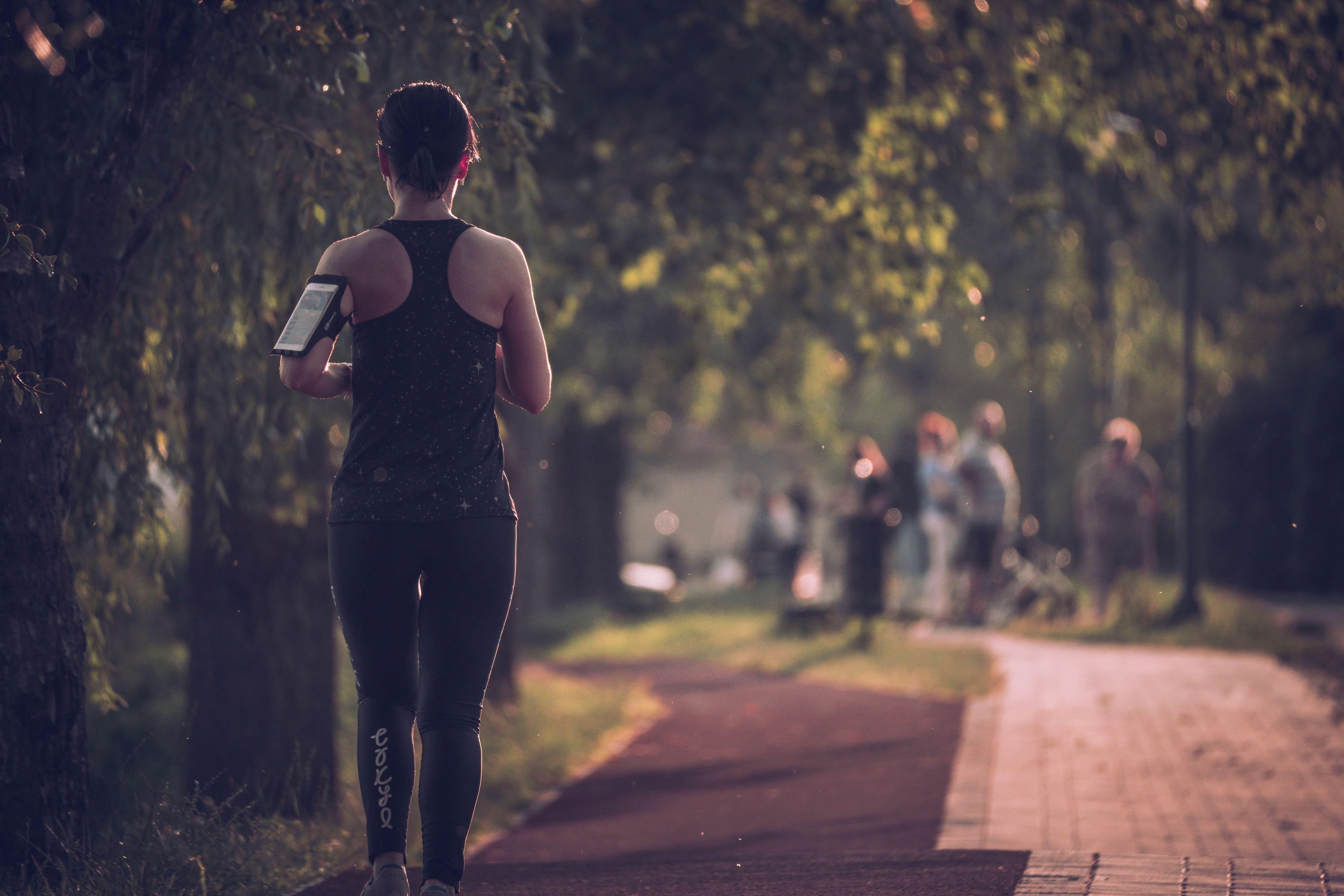 Woman running through forest